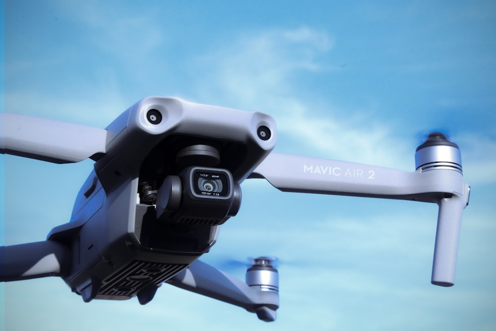 black and gray drone under blue sky during daytime