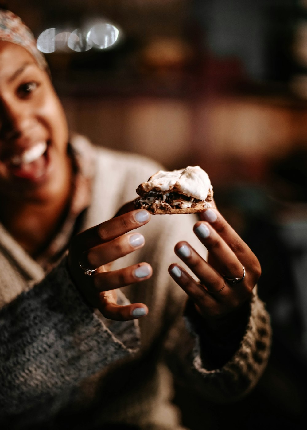 person holding brown and white ice cream