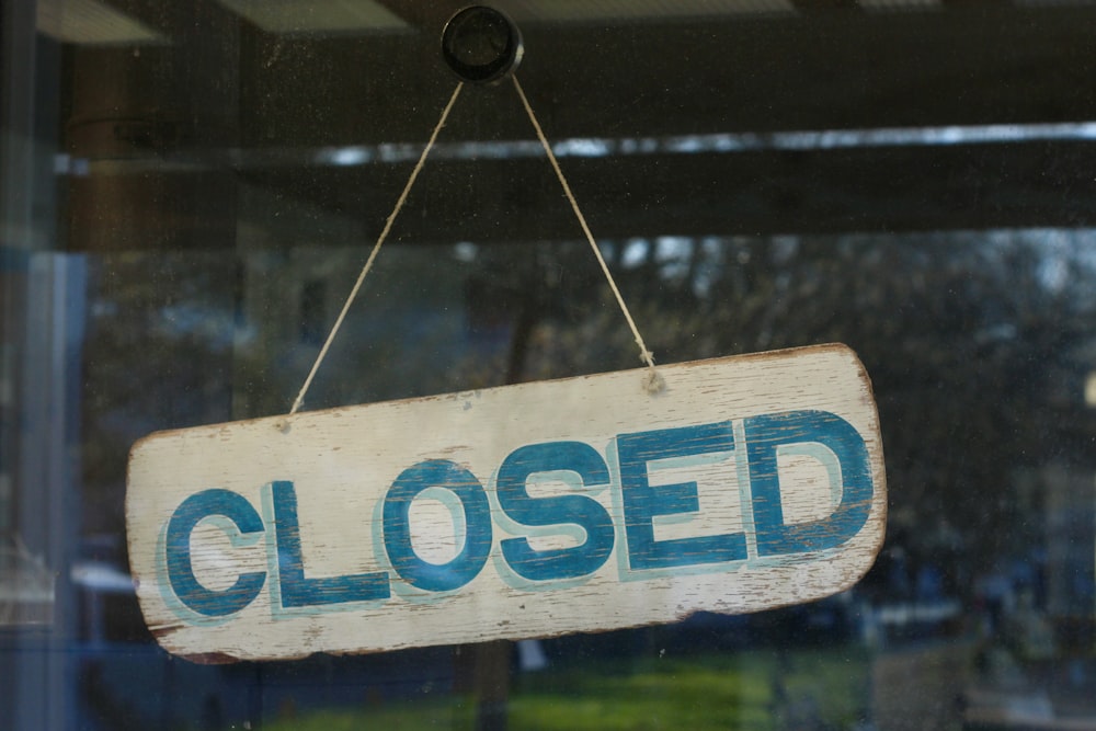 blue and white wooden open signage