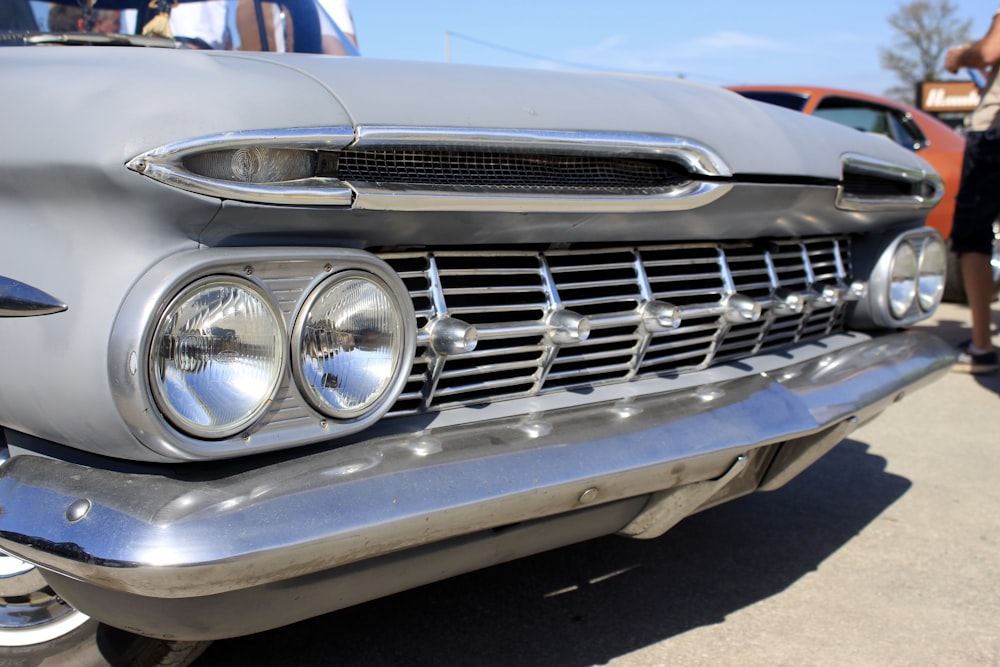 blue and silver car in close up photography