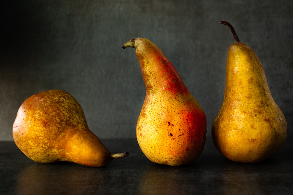 3 yellow and red fruits