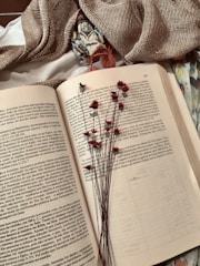white book page with black and red pen