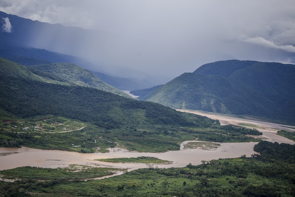 green mountains under white clouds during daytime