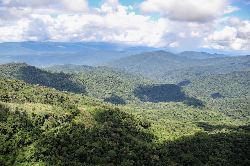 green mountains under white clouds during daytime