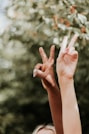 persons hand with white manicure