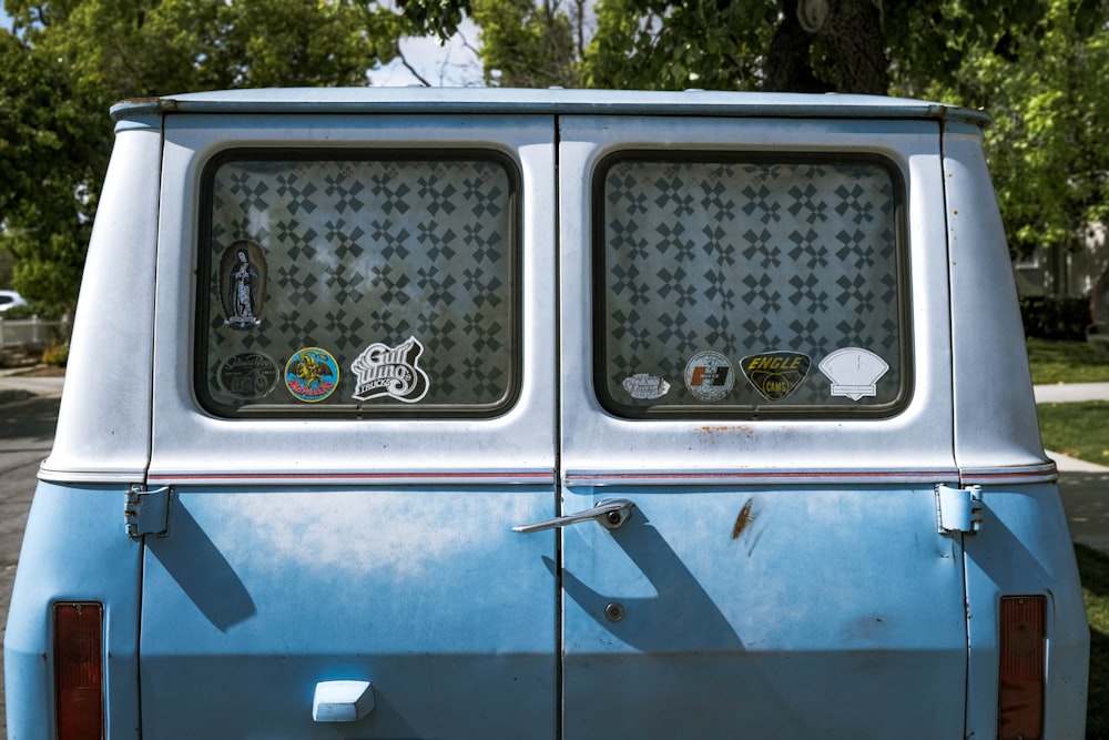 blue and white van with white and green sticker