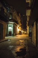 Historic street lamp illuminating a cobblestone street in Puebla's old town.