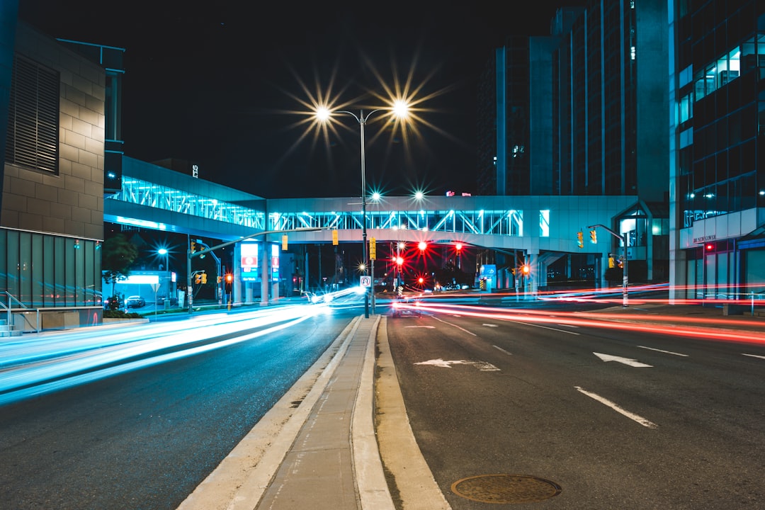 cars on road near building during night time