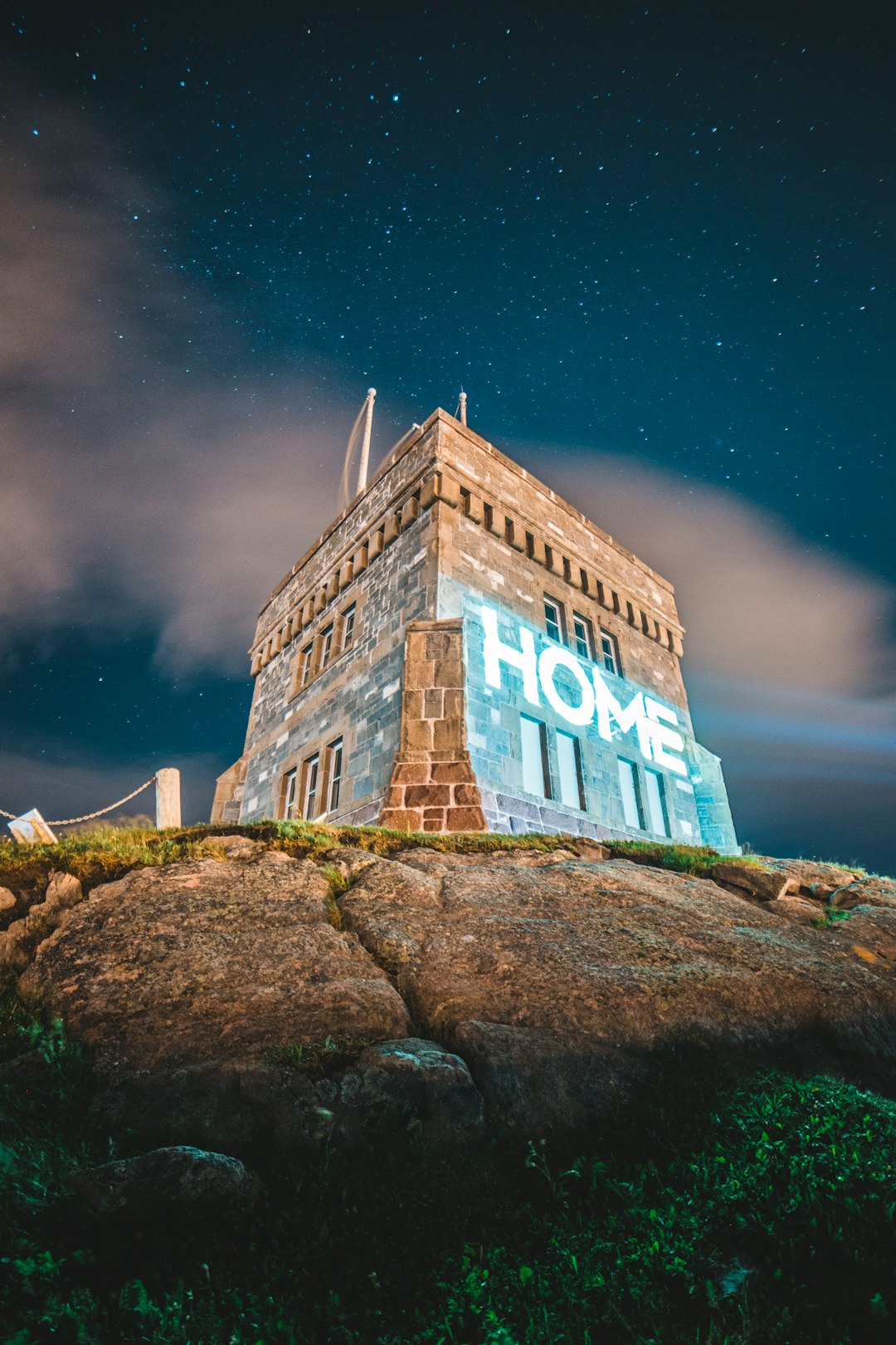 brown concrete building under blue sky during nighttime