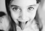 grayscale photo of womans face