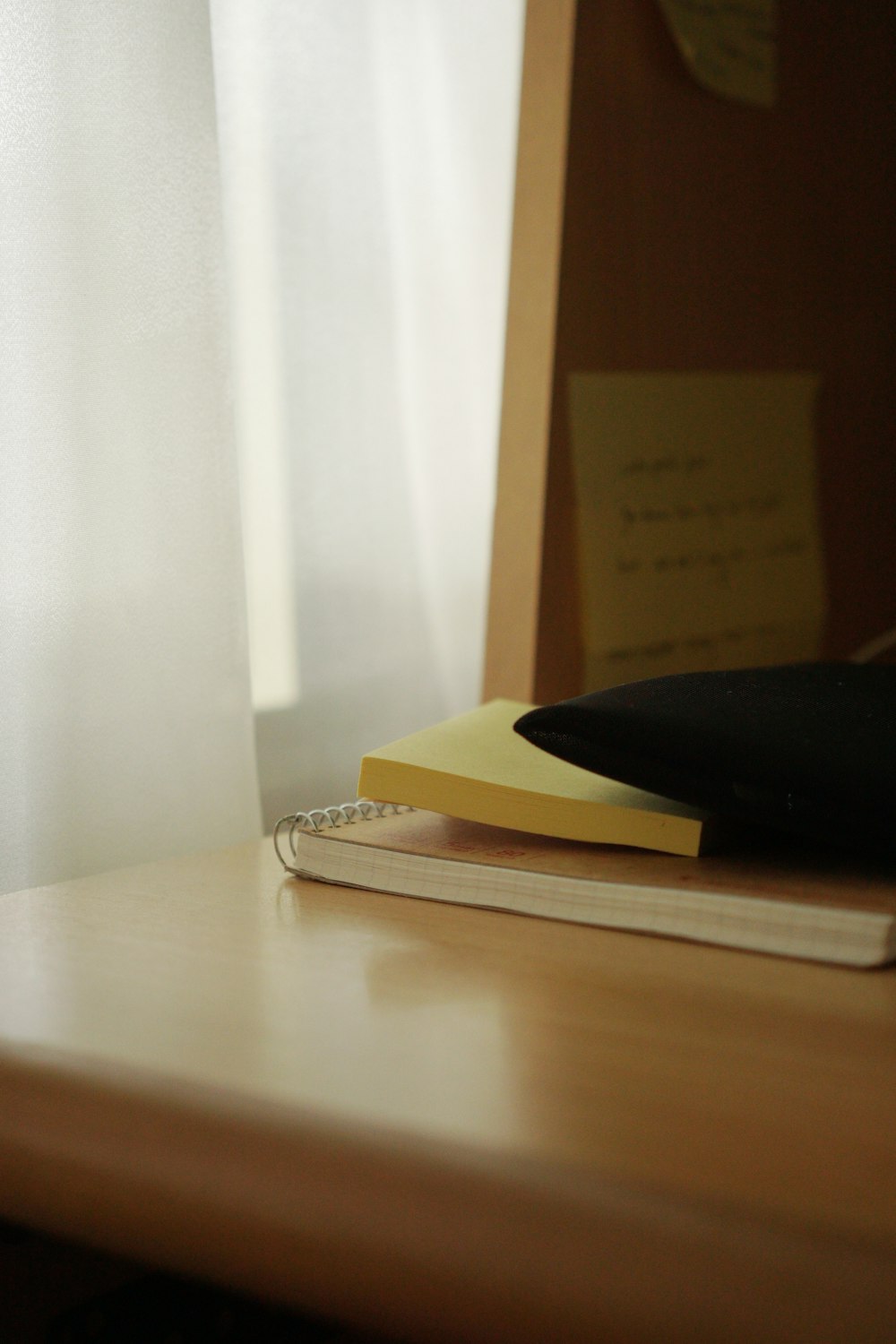 brown and yellow book on brown wooden table