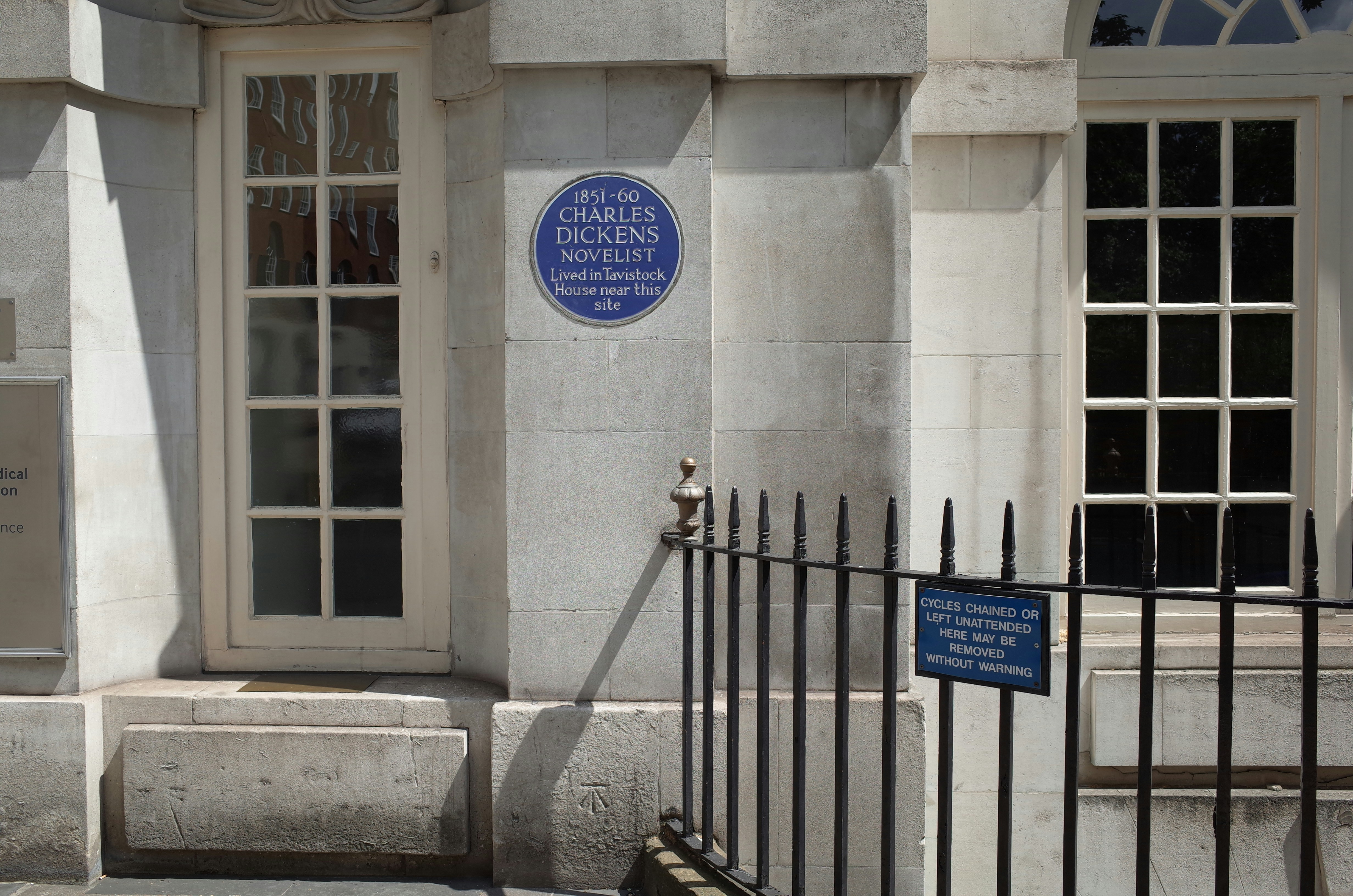 Blue and white signage on white concrete building photo – Free Grey ...