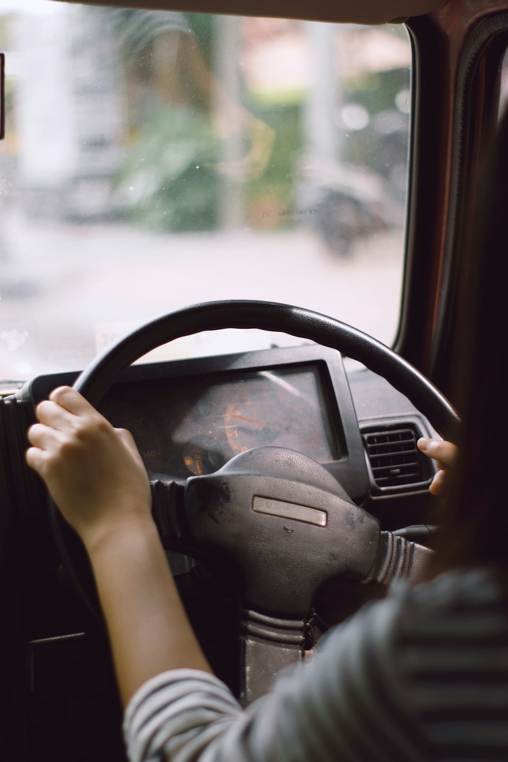 person driving car during daytime