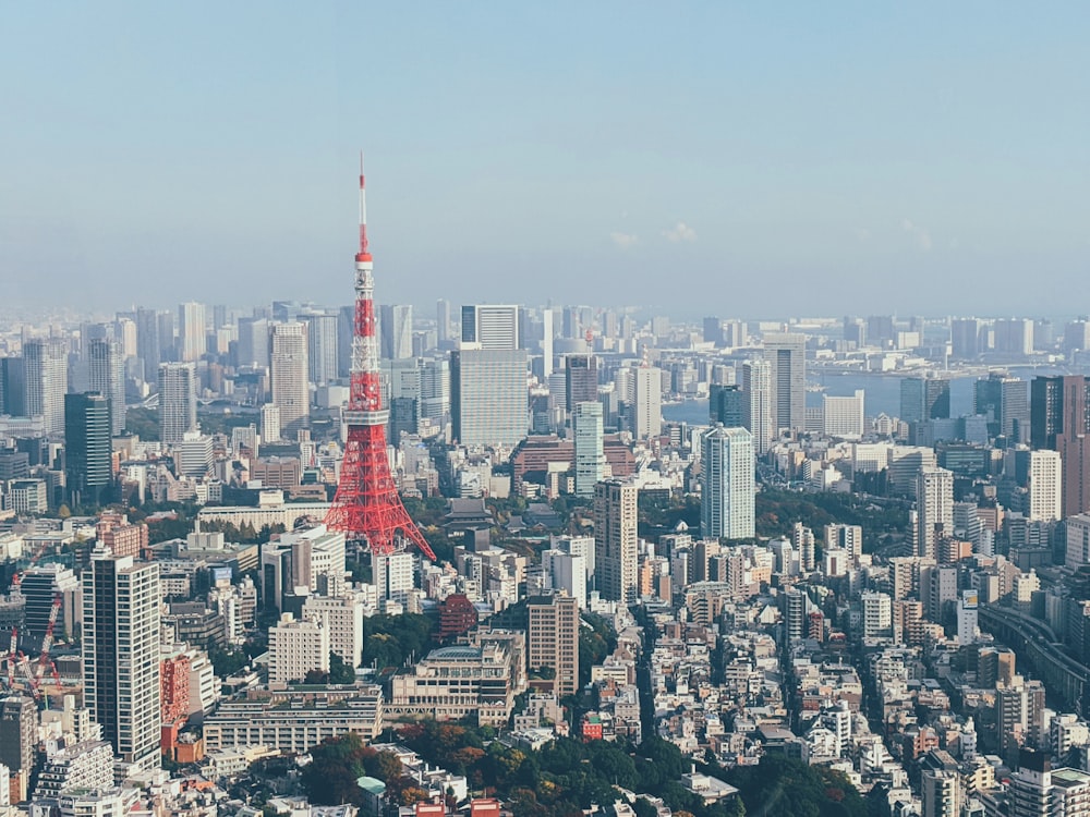 red and white tower in the city during daytime