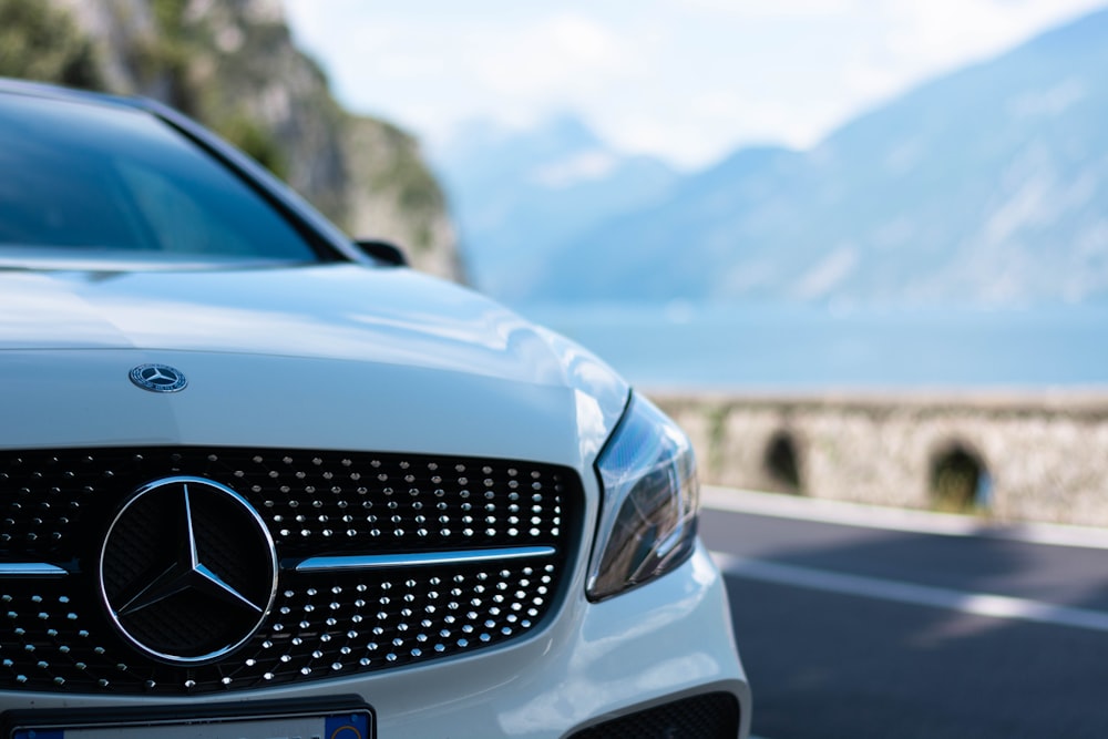 black mercedes benz car on road during daytime