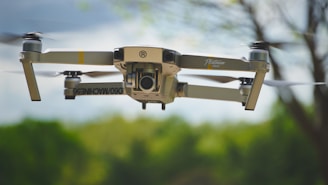 black and gray drone flying during daytime