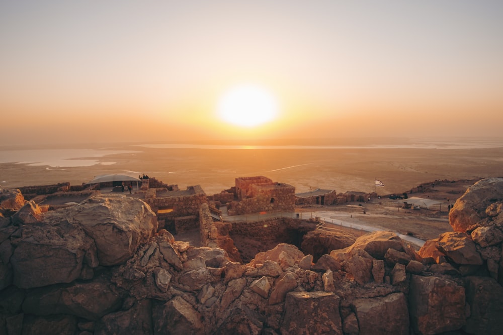 brown rock formation during sunset