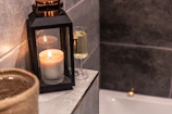 A cozy self-care corner with candles, skincare products, and a soft blanket.