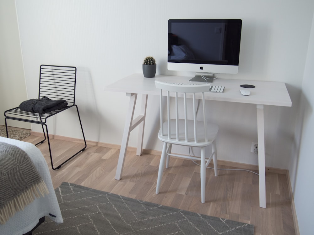 white wooden table with black flat screen tv