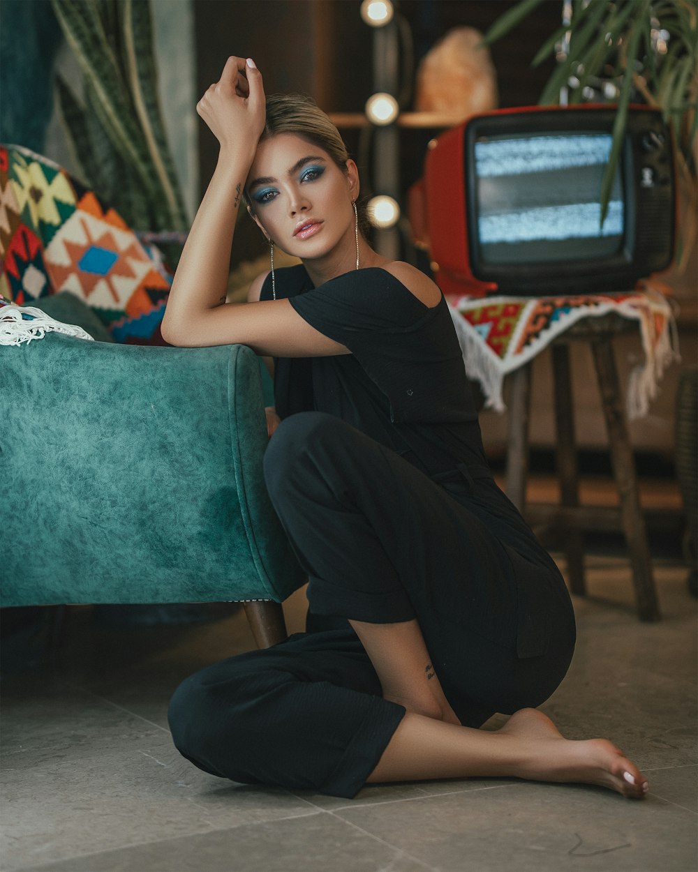 woman in black dress sitting on chair