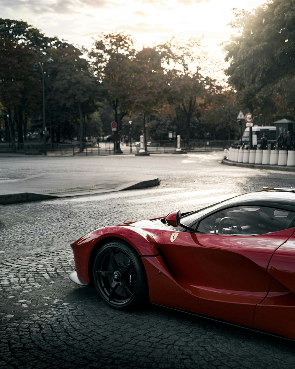 red ferrari 458 italia on road during daytime