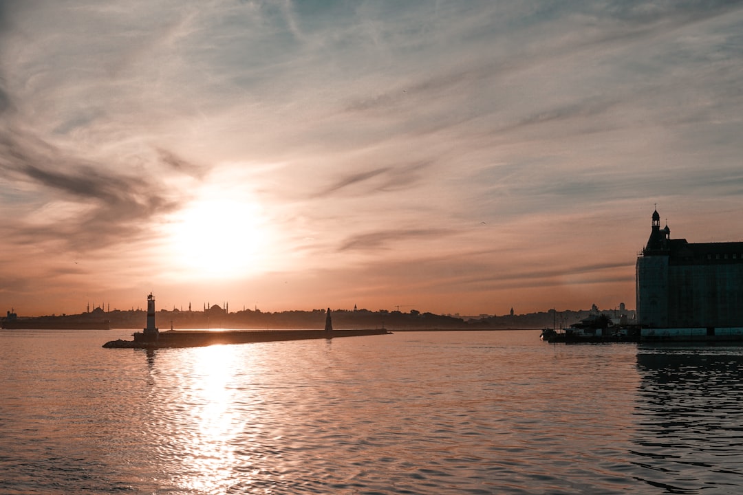 body of water during sunset