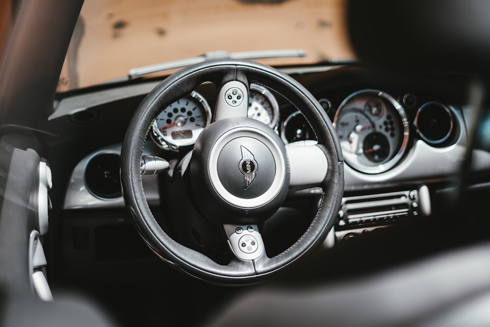 black and silver mercedes benz steering wheel