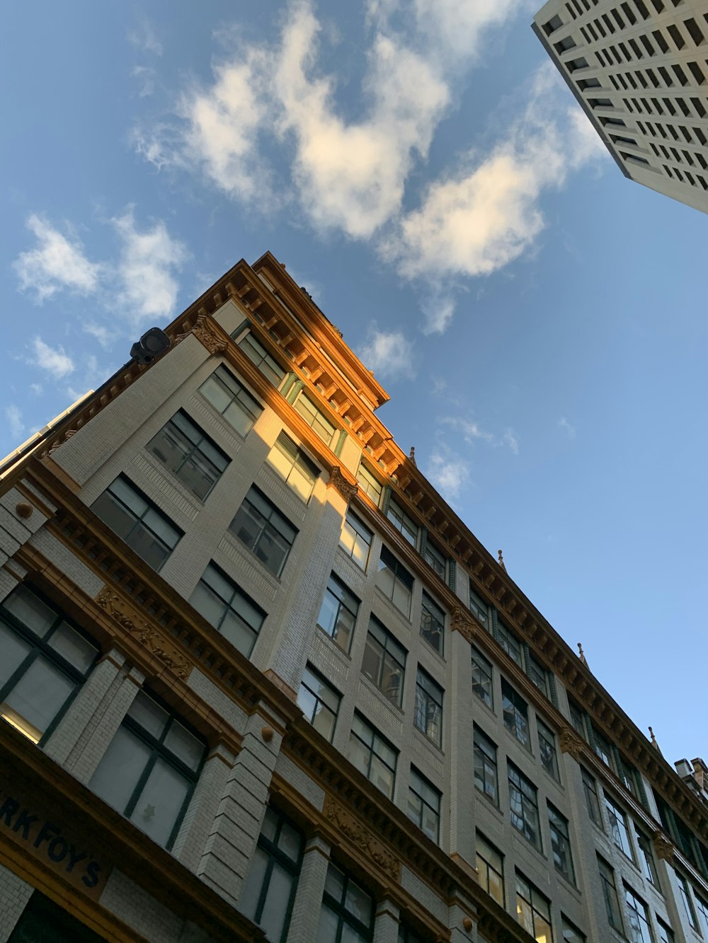 brown concrete building under blue sky during daytime