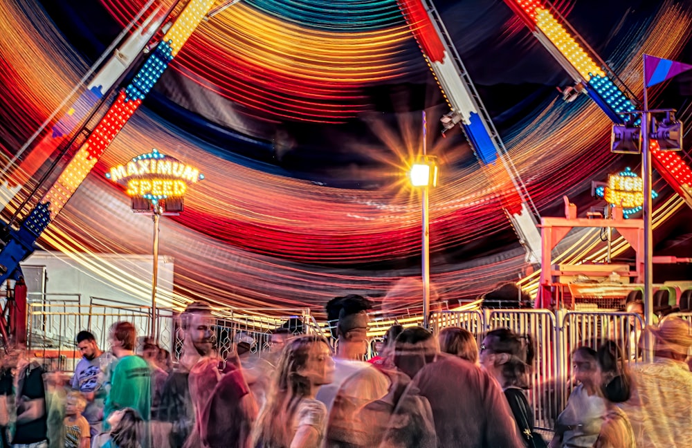 people in a carousel during night time