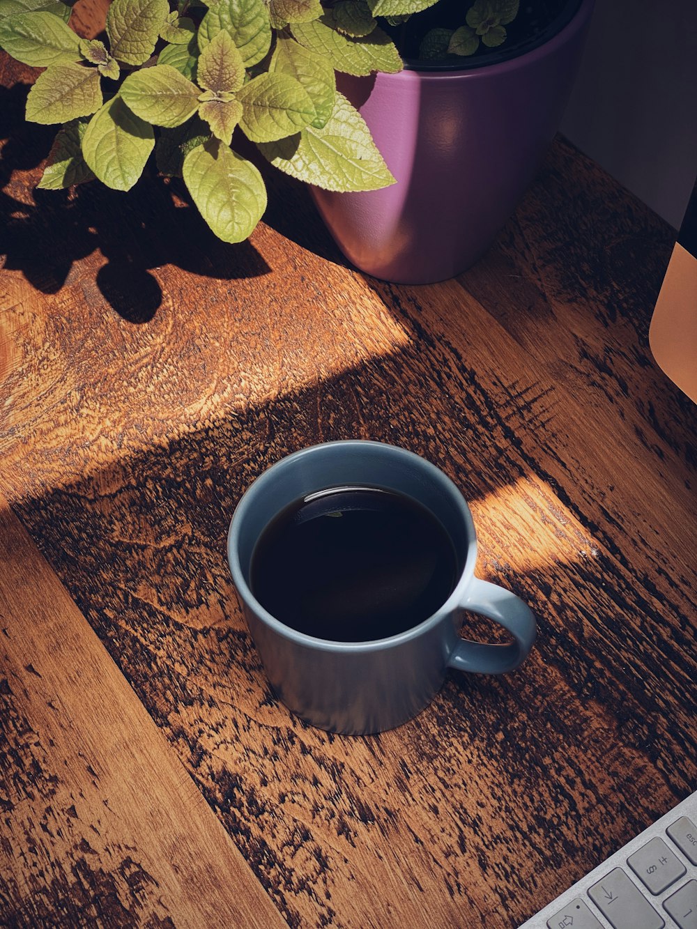 white ceramic mug with black liquid inside