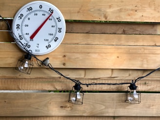 white and red analog gauge
