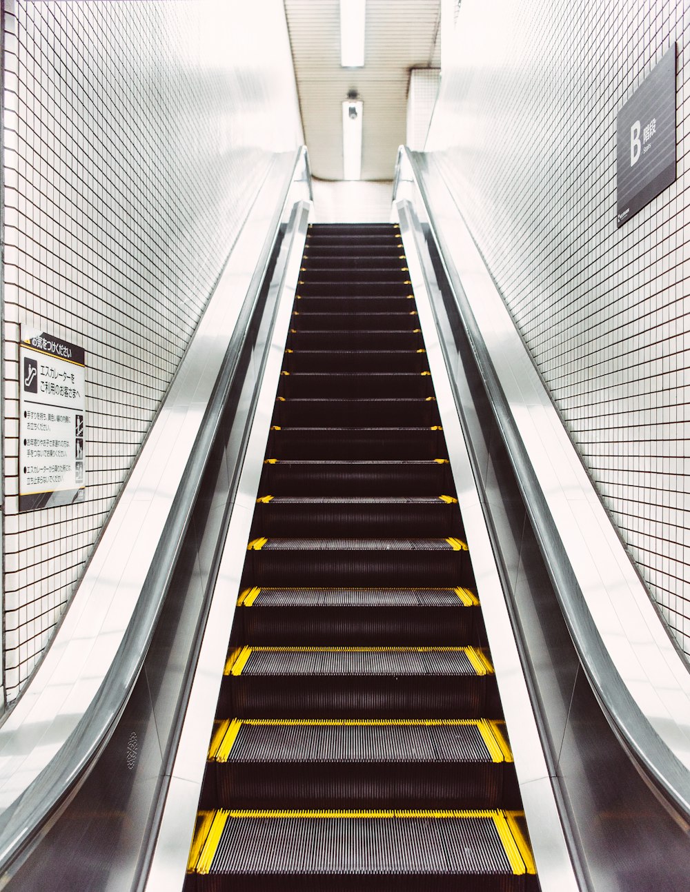 black and white escalator with no people