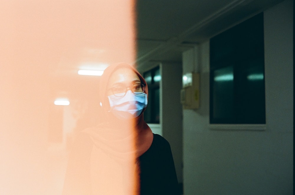 woman in black shirt wearing eyeglasses