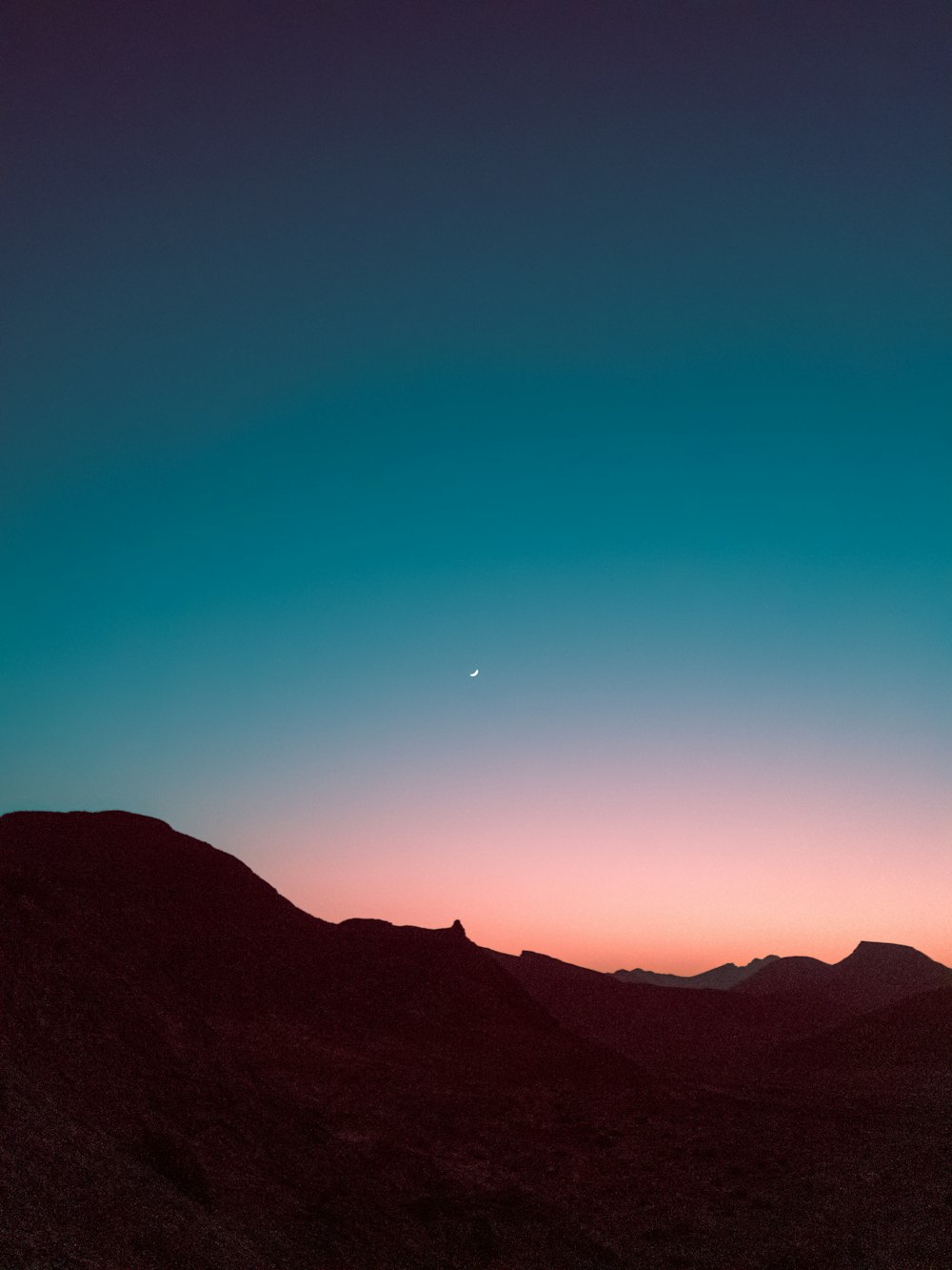 silhouette of mountains during sunset