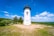 white and black lighthouse under blue sky during daytime
