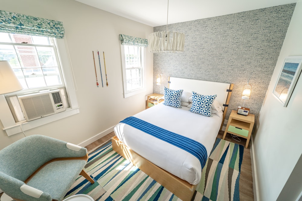 white and blue striped pillow on blue and white striped bed