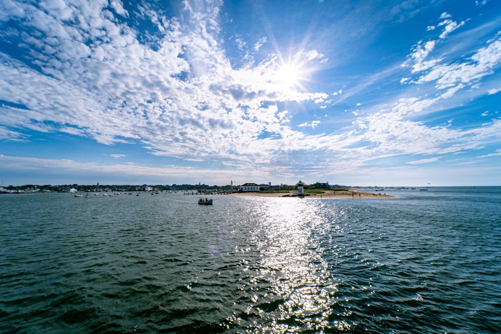 body of water under blue sky during daytime