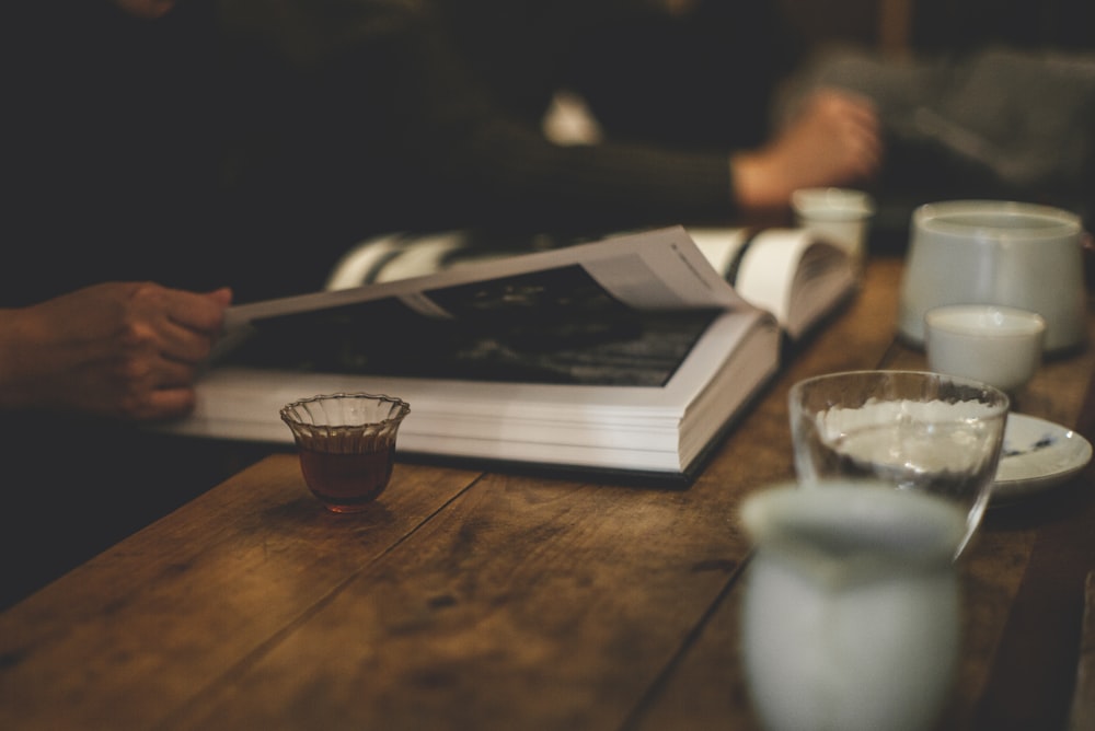 clear drinking glass on brown wooden table