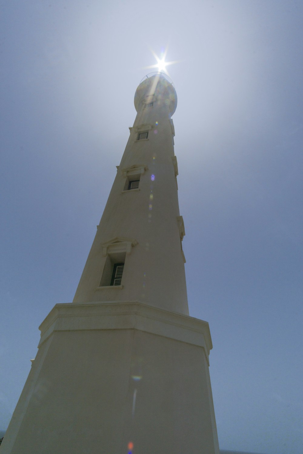 white concrete tower under blue sky during daytime