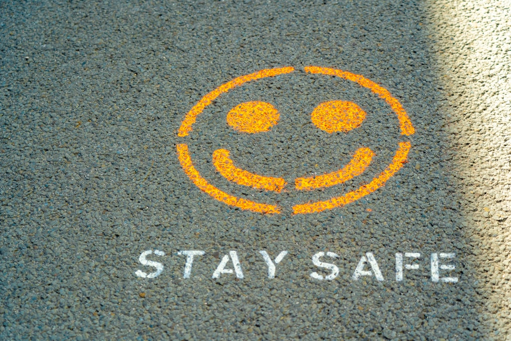 spray painted stay safe sign