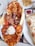 A platter filled with various types of grilled meats including chicken and lamb, accompanied by a scoop of rice, slices of flatbread, and vegetables. There is a separate plate with hummus and a portion of flatbread on the side.