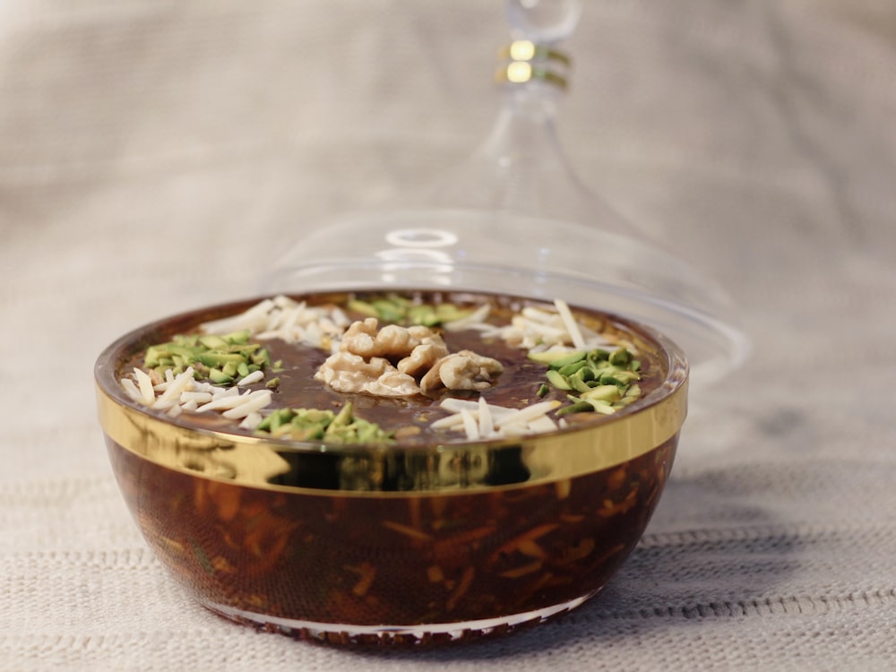 brown and white beans in clear glass bowl