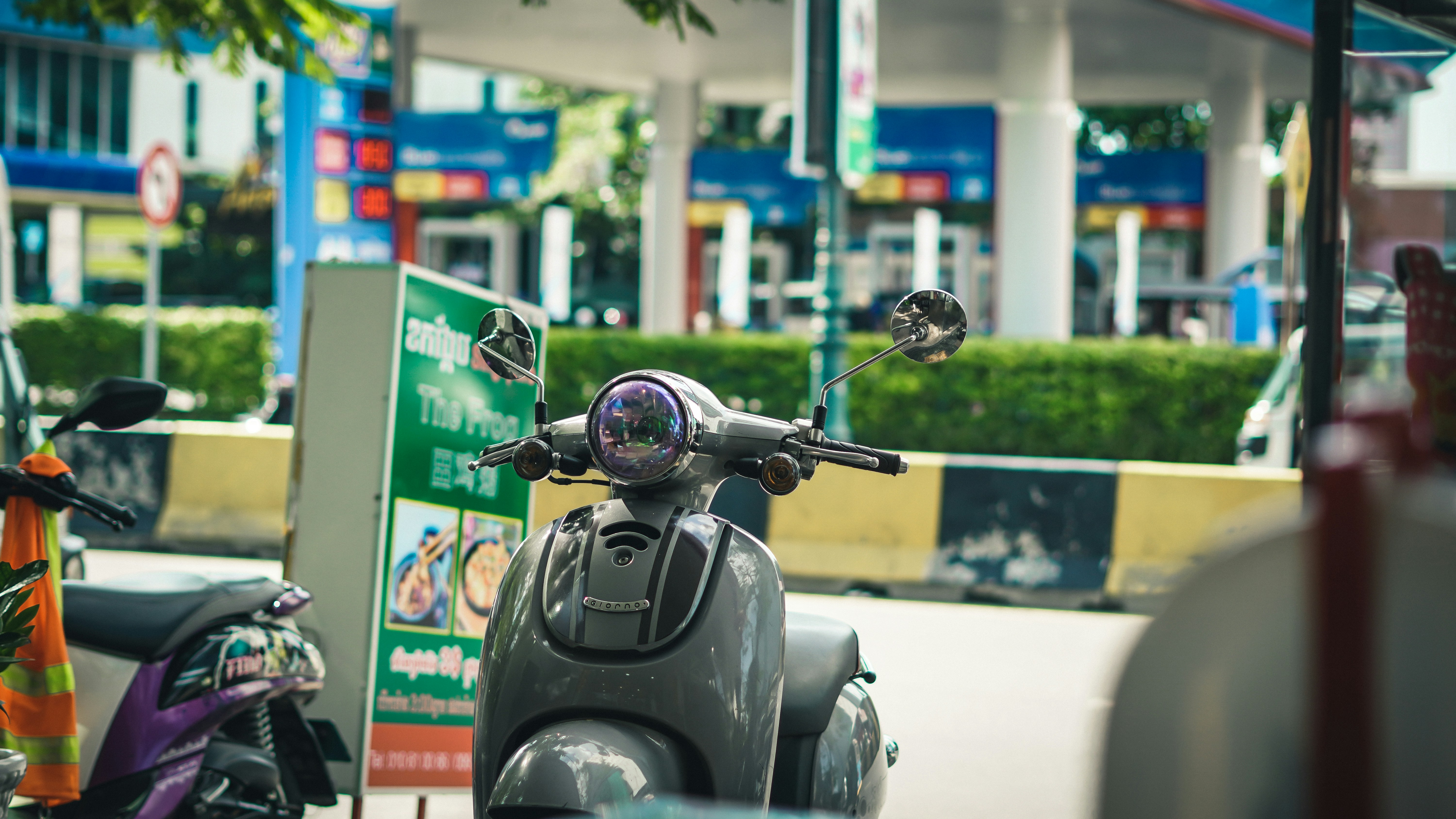 black motorcycle parked on the street during daytime