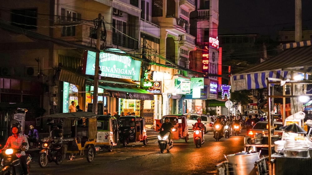 people walking on street during nighttime