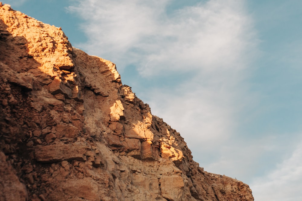 brown rock formation under blue sky during daytime