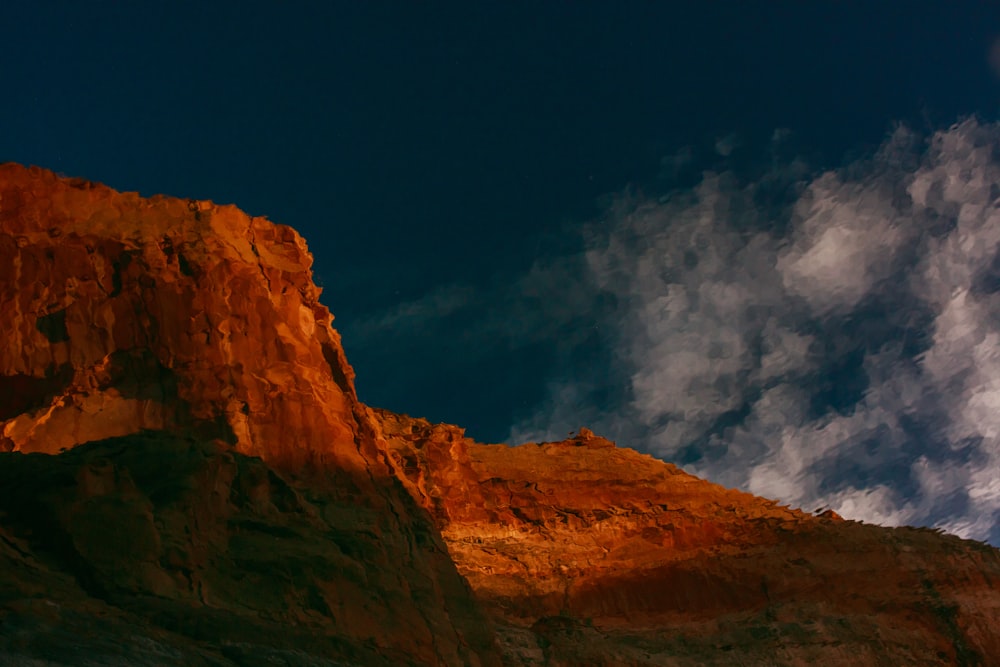 brown rock formation under blue sky