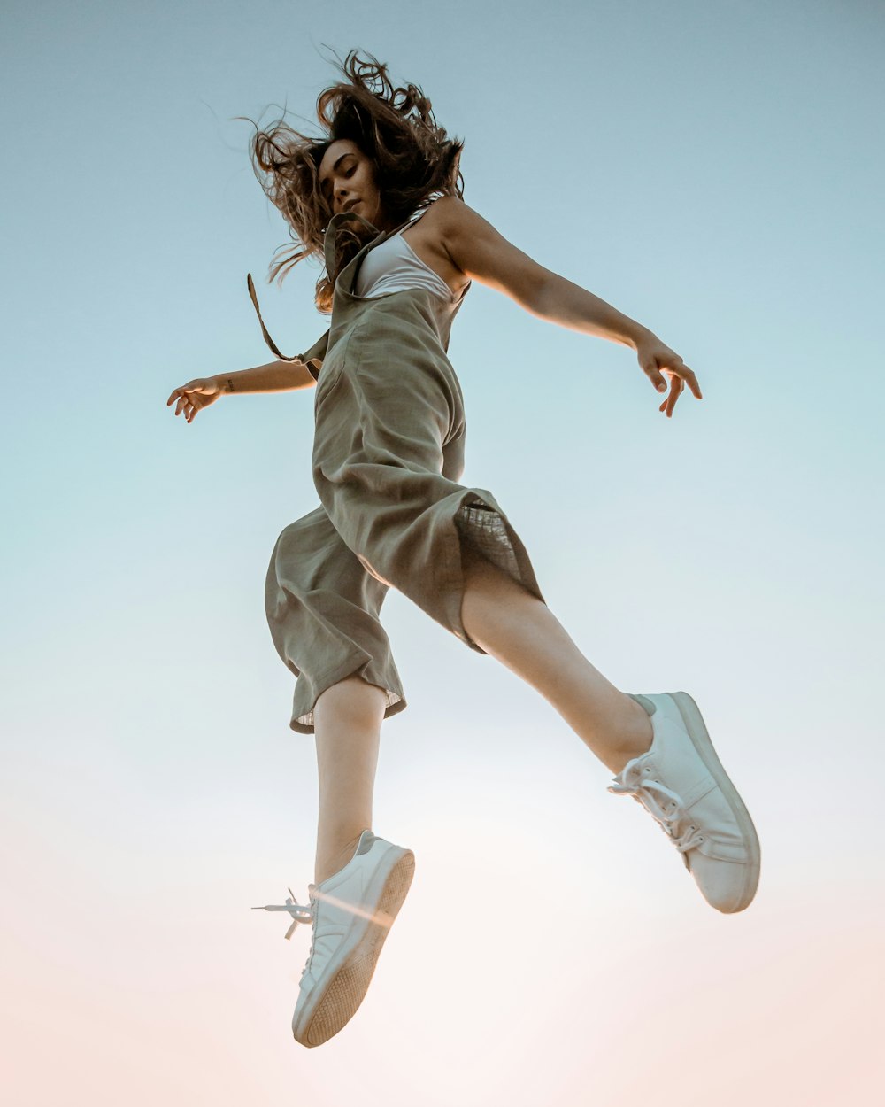 woman in white dress jumping