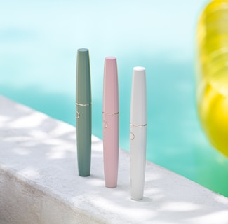 Close-up of colorful pool cleaning materials arranged neatly on a modern surface.