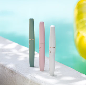 Close-up of colorful pool cleaning tools arranged neatly.