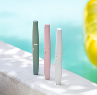 Close-up of colorful pool cleaning tools arranged neatly.